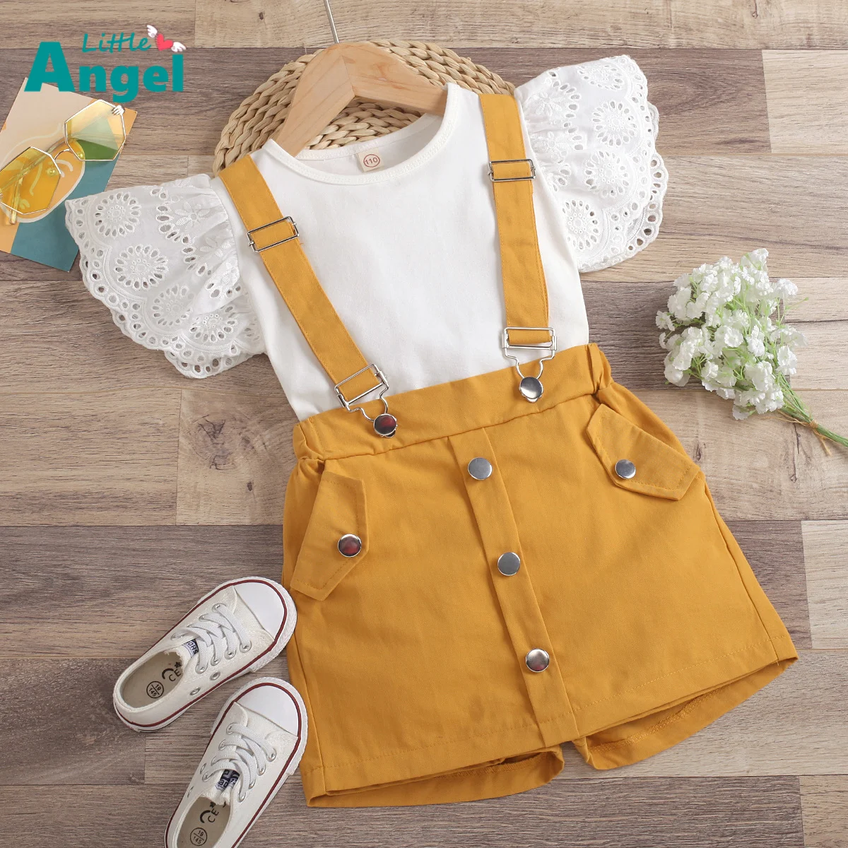 

Za summer new grils clothes girl solid color hollow out fly sleeve round neck T-shirt + detachable strap shorts skirt set girl