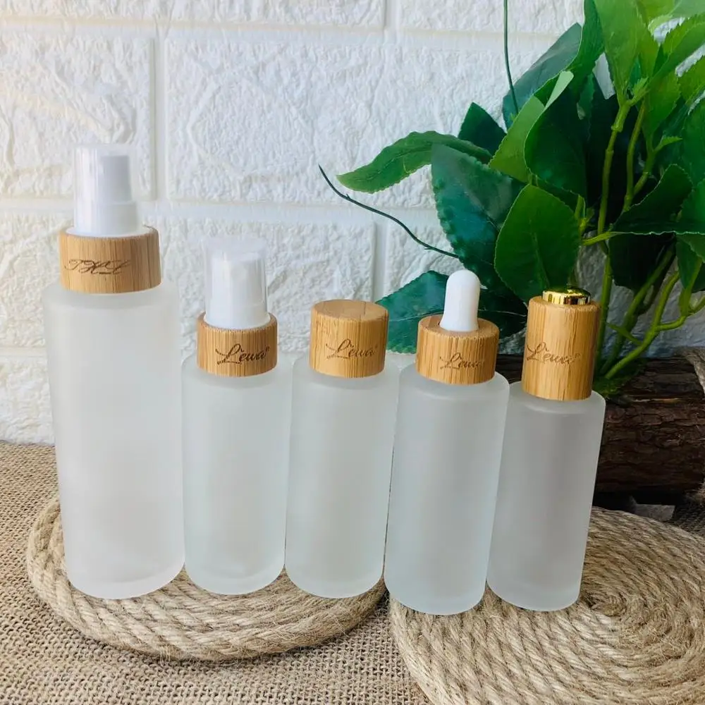 Refillable 4 oz transparent matte glass lotion spray pump bottles with luxury bamboo lid wooden cap Cosmetic container 5 oz 1 oz