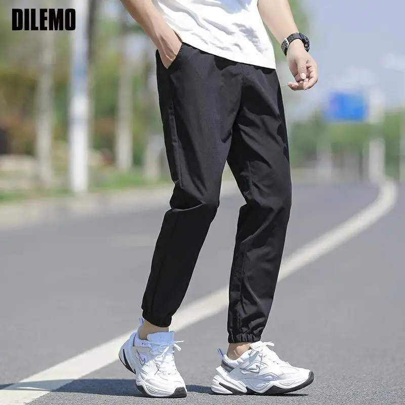 

Top Quality New Brand Casual Fashion Quick Dry Compression Long Pants Men Jogging Elastic Strappy Trousers Men's Clothing