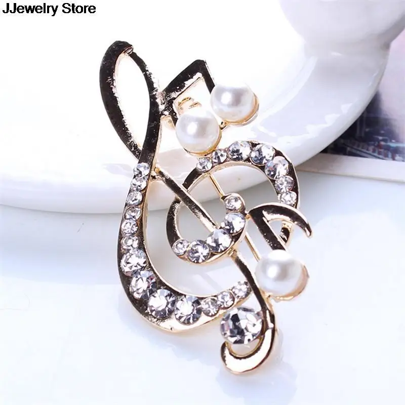 Элегантная брошь в форме музыкальной ноты с украшением виде кристаллов булавки