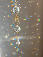 aesthetic crystal sun catcher prism ball rainbow maker with beads sequins and accent charm on gold chain perfect for room
