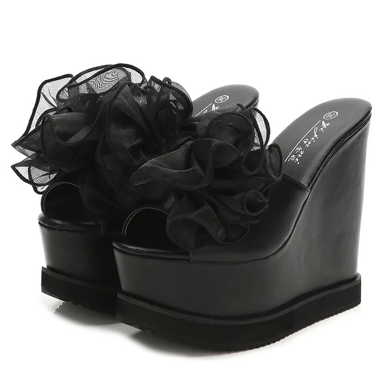 

Korean version 2020 summer new Hentian high thick bottom slope heel women's sandals 15cm super high heel muffin one word sandals