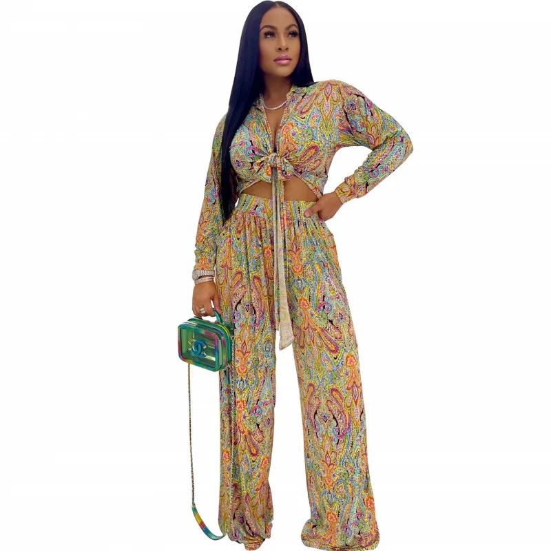 

Женский комплект из двух предметов, укороченный топ на шнуровке с длинным рукавом и яркий принт, модные офисные брючные костюмы с широкими ш...