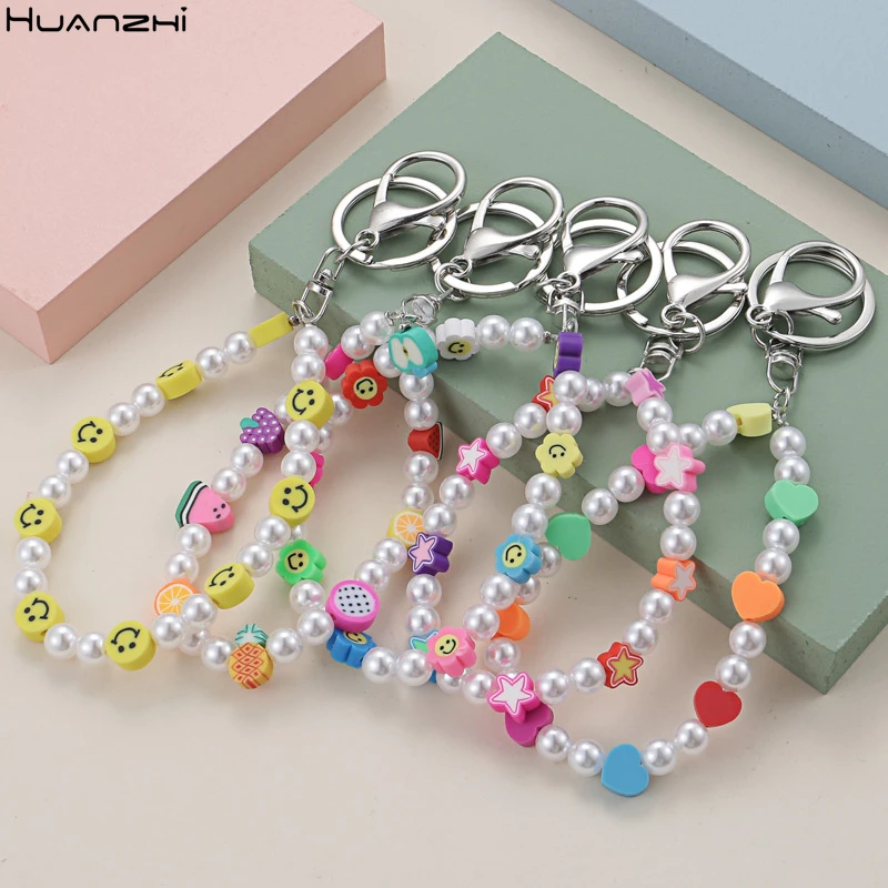 

HUANZHI 2021 New Fashion Keychain Yin Yang Evil Eye Smiley Heart Pearl Beaded Charm for Women Jewelry Keychain Accessories