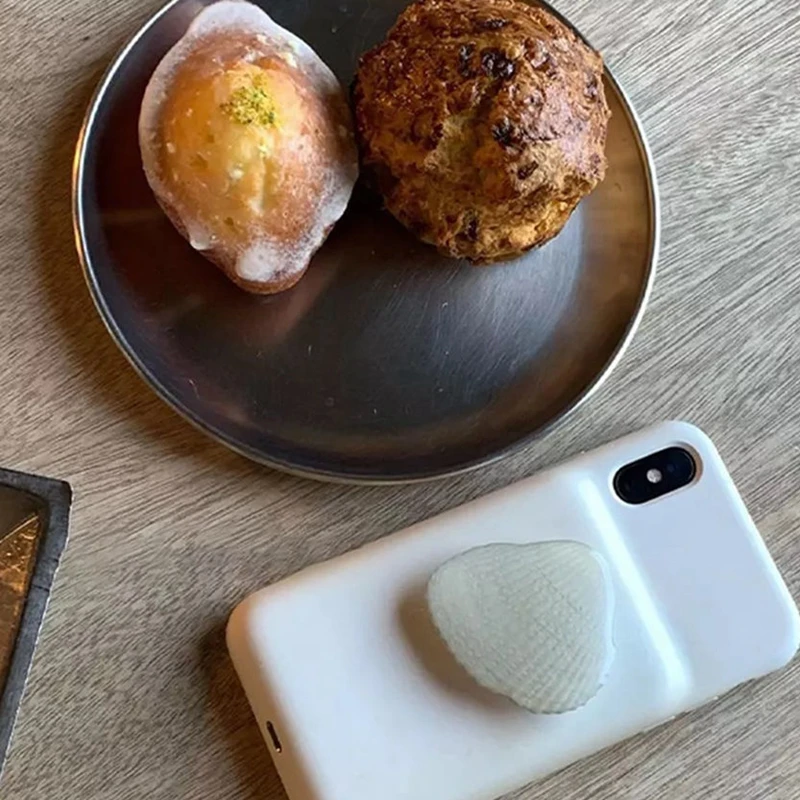 

Suitable for mobile phone bracket shell airbag bracket temperament cool air cushion telescopic lazy mobile phone ring buckle