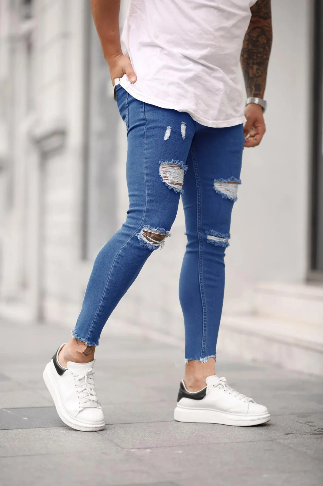 

Men's pierced elastic tight legged jeans heel cropped jeans