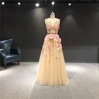 newest high quality customized luxurious beadings champagne color and pink feathers sleeveless floor length party evening dress