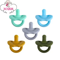 xcqgh 1pcs solid color newborn infant toddler baby pacifier round nipple soother food grade silicone teething