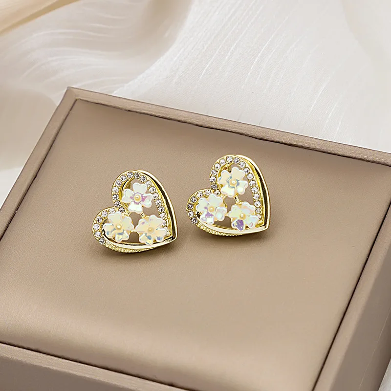 

Silver Needle 2021 new super fairy shell flower peach heart earrings fashion small fresh wild peach heart fairy earrings