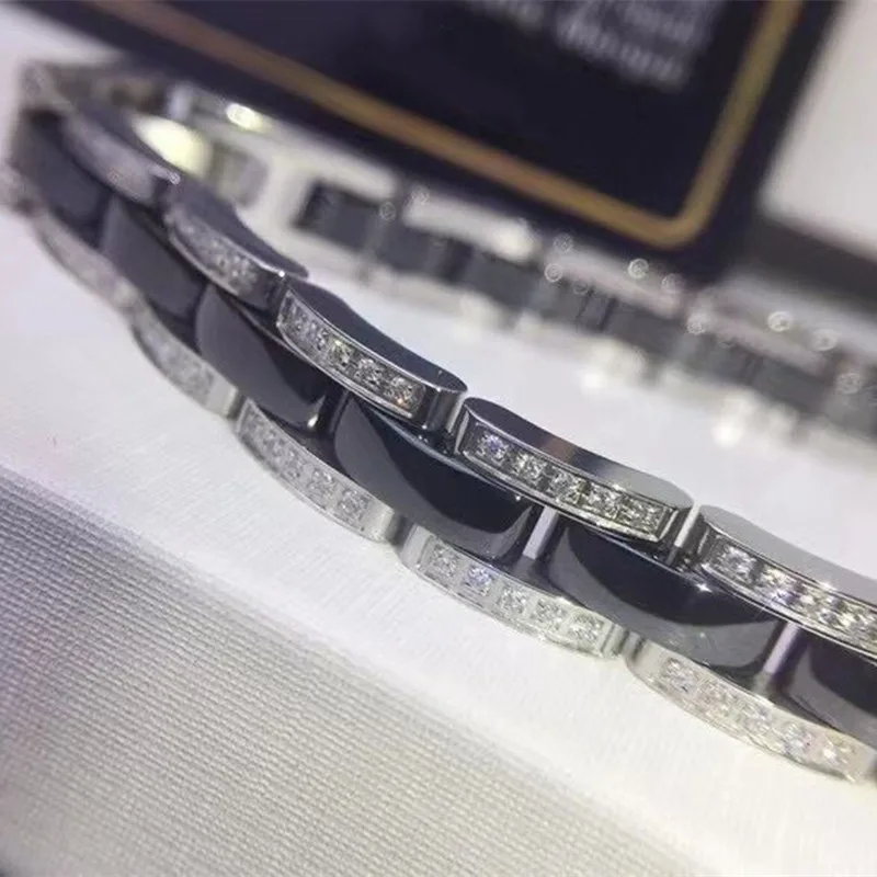

Classic single and double row ceramic inlaid diamond bracelet European and American fashion black and white titanium steel lover