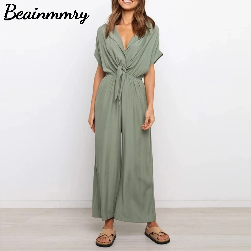 

Женские повседневные однотонные комбинезоны с высокой талией и коротким рукавом, на шнуровке, с V-образным вырезом, модные брюки с карманами...