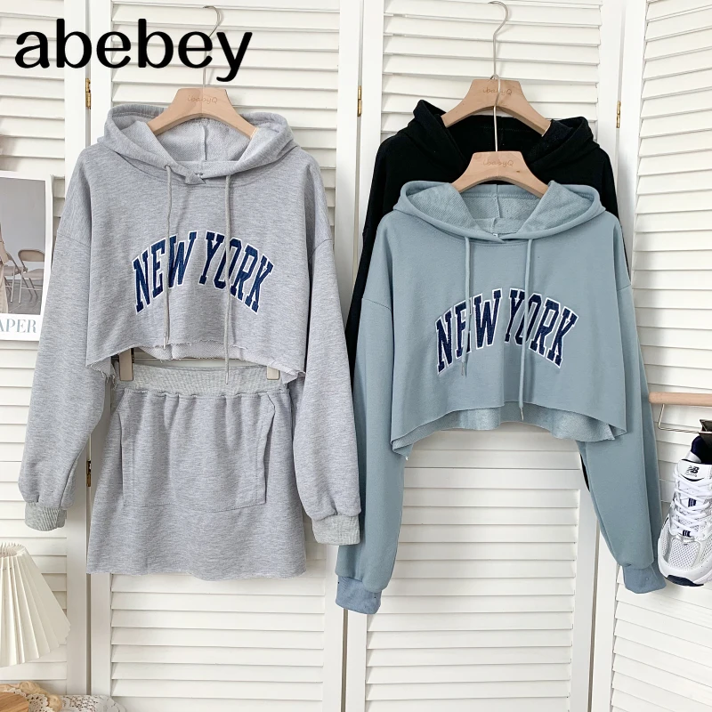 

Fashion hooded collar long sleeve short letter Pullover Top + high waist short A-line Skirt two-piece set 2021 New Spring Autumn