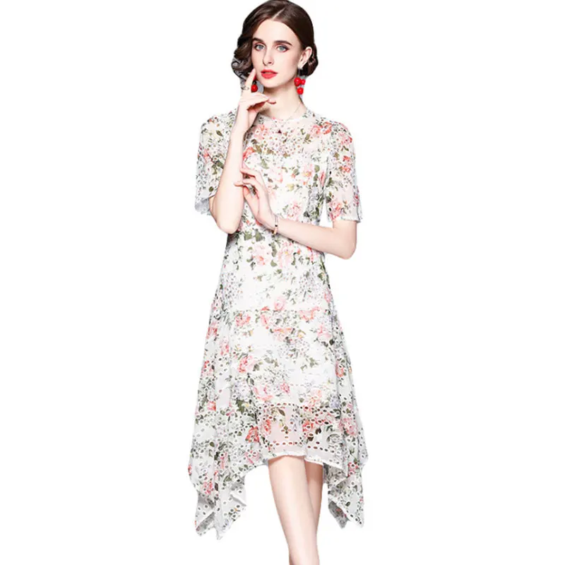 

2021 summer new French round neck short sleeve romantic embroidery printing hollow irregular dress solid color design sense