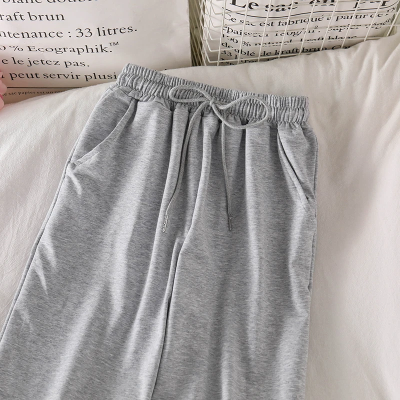 

Ripped pants female ins tide 2020 summer new design sense wild student ins sports casual pants straight trousers