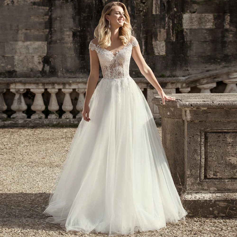 

See Through Scoop Neck A-line Tulle Wedding Dresses 2021 Chic Lace Appliques Buttons Back Floor Length Cap Sleeves Bridal Gown