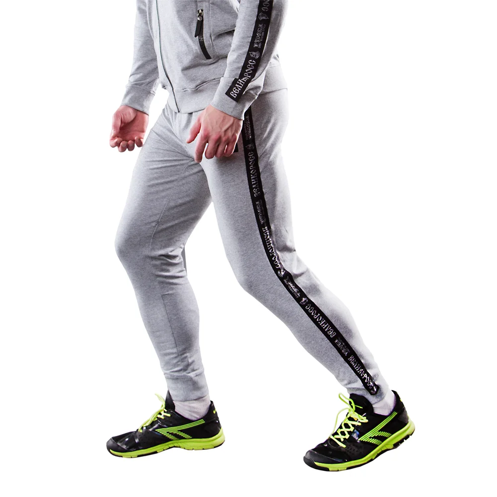 Спортивные штаны Великоросс цвета серый меланж жаккардовые лампасы и брендовые