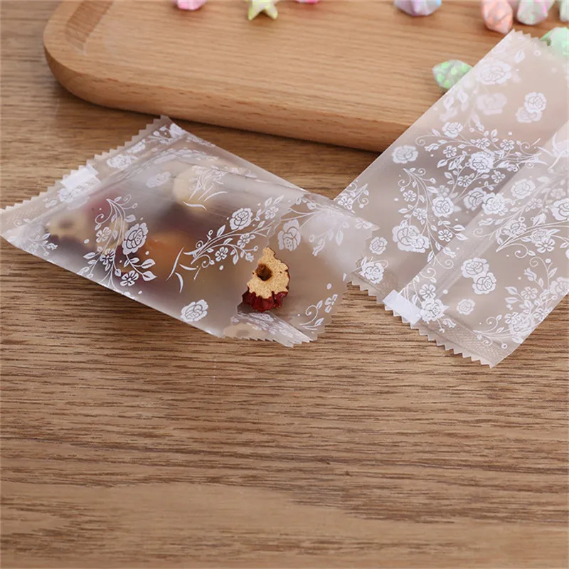 

100Pcs White Flower Nougat Cranberry Cookies Frosted Transparent Machine Sealing Bags Party Packaging