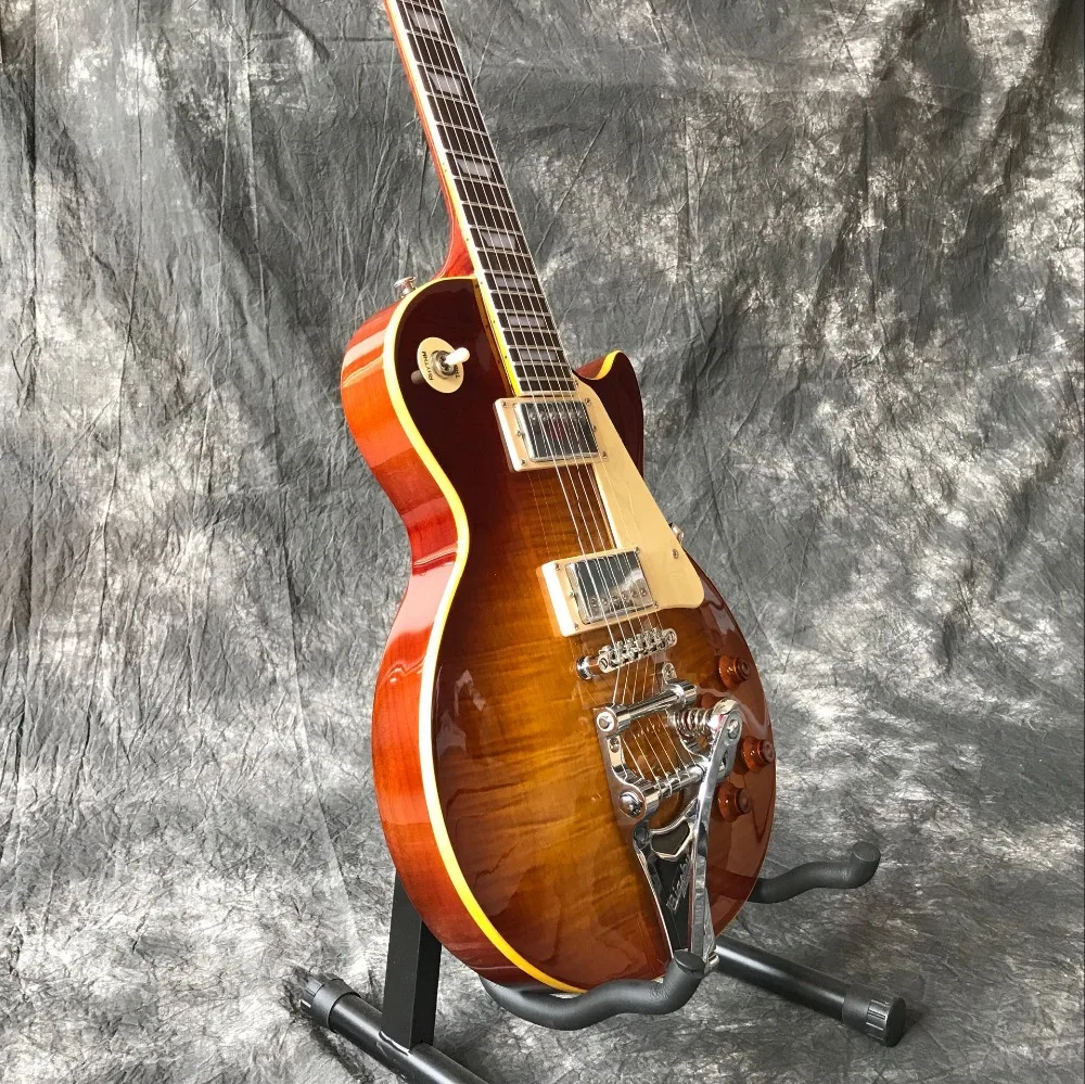 

Custom shop.Tiger Flame standard electric guitar.Sunburst color jazz gitaar,musical instruments.vibrato system