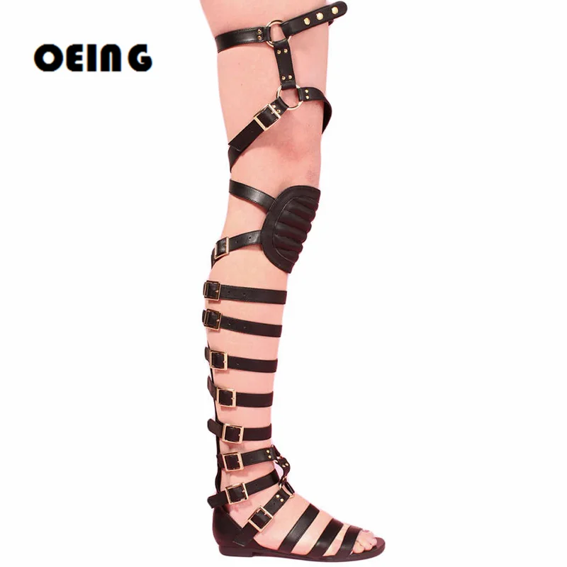 

Женские кожаные сапоги выше колена с ремешком и пряжкой