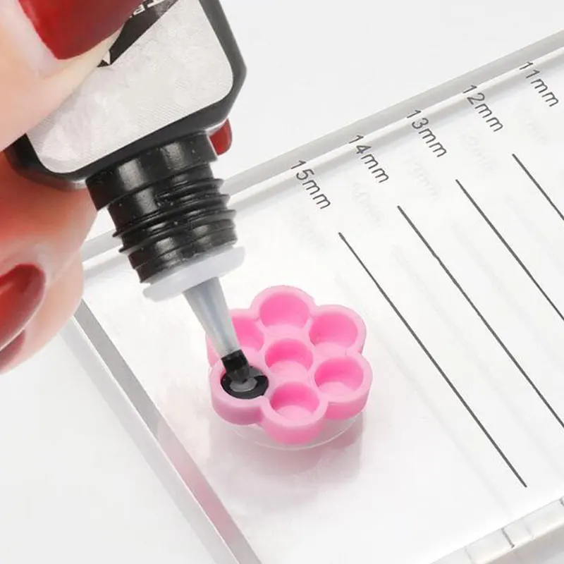 

Flower-Shaped Lashes Pallet Adhesive Pigment Cups 100Pcs Grafting Eyelash Glue Cup Holder Extension Tool Eye Lashes Stand