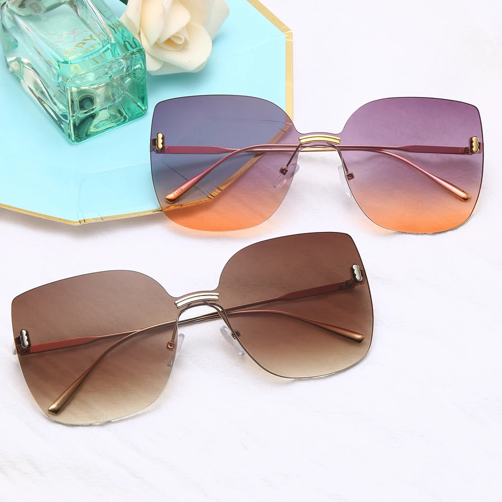

Fashion Rimless Sunglasses Women Oversized Metal Sunglasses Luxury Cat Eye Sunglasses Eyewear UV400 Shades gafas de sol