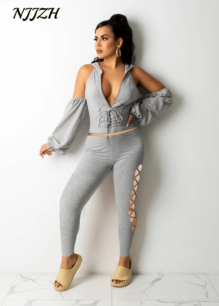 

NJJZH 2021winter spring Fashion Women Solid Sexy V Neck Long Sleeve pack hip Hollow Out hooded Bandage Leisure sport Jumpsuits