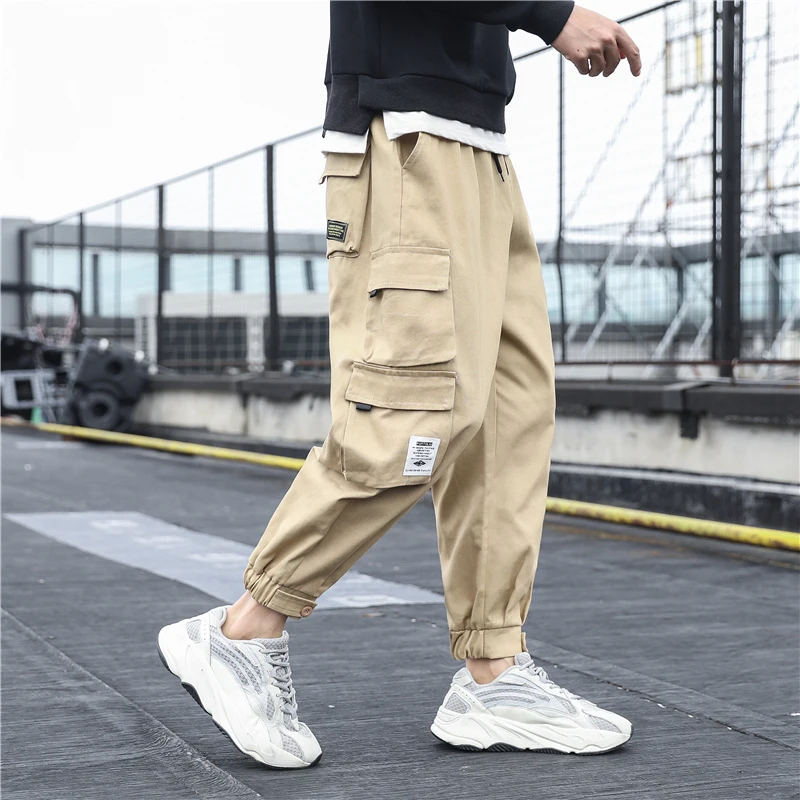Nowe męskie boczne kieszenie Cargo spodnie 2021 czarne Hip Hop Harem spodnie Casual męskie spodnie dresowe do biegania moda Streetwear spodnie 5XL