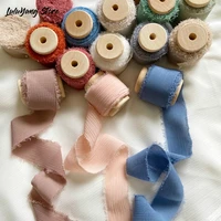 handmade cotton chiffon ribbon frayed edges with wooden spool for rustic wedding event invitation flower bridal bouquet wrapping