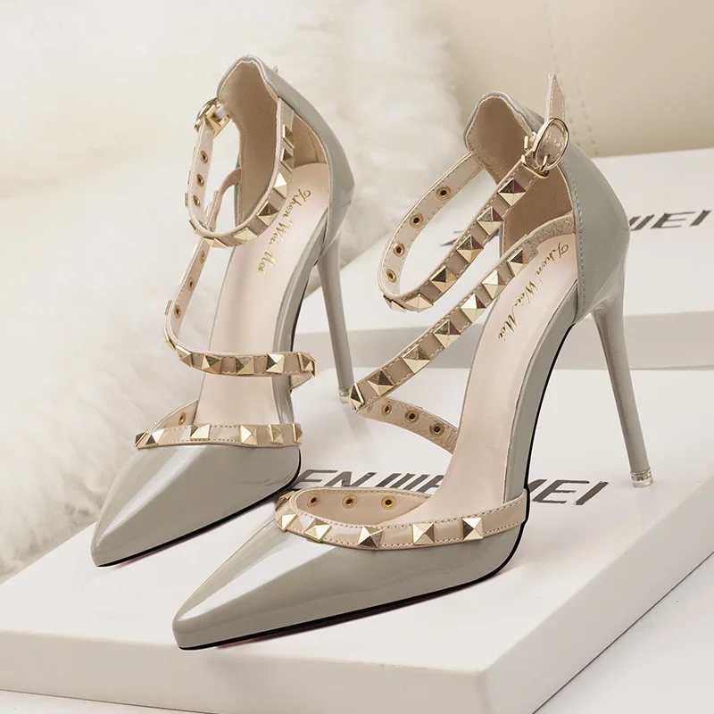 European and American simple sexy nightclub stiletto high heels shallow mouth pointed rivet hollow word belt sandals
