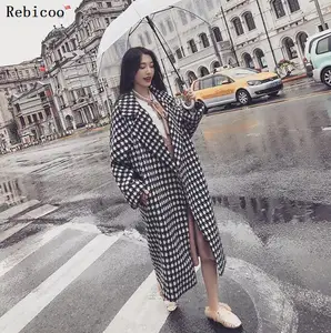 Женское длинное зимнее пальто-кокон с лацканами