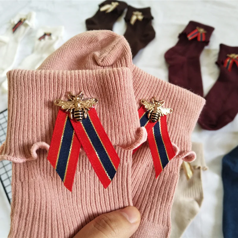 

Hot bee webbing pile pile socks curling Japanese autumn and winter cotton female socks solid color fungus long socks
