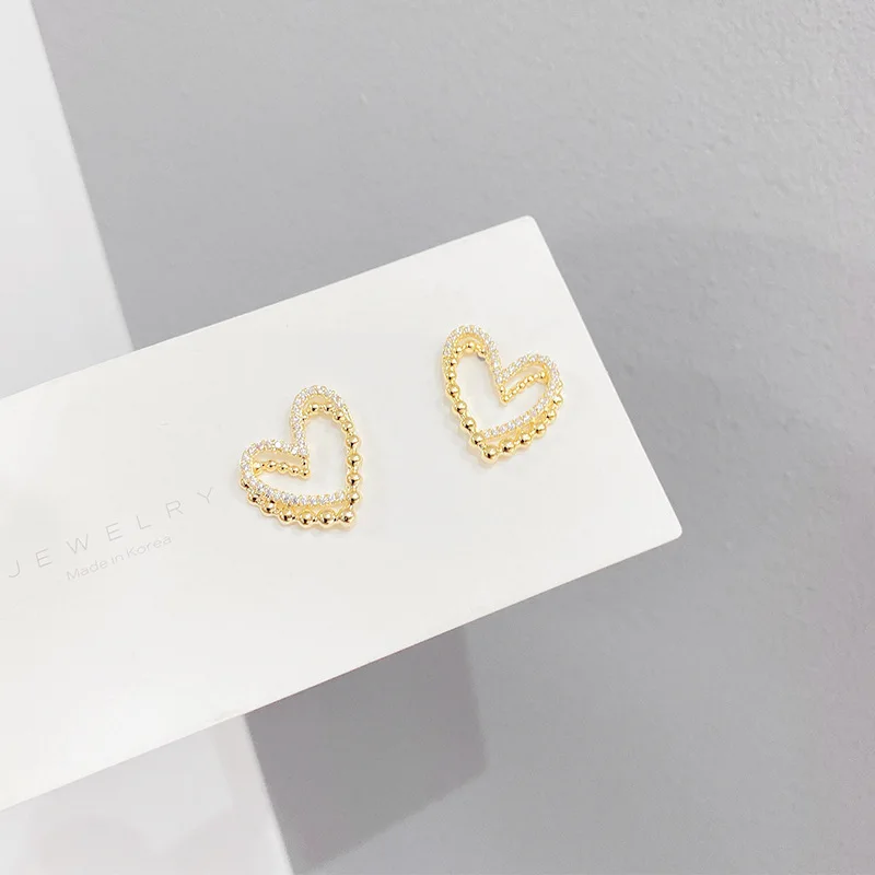 

Hot Sale Exquisite CZ Pierced Heart Stud EarringsUnique Delicate Earrings