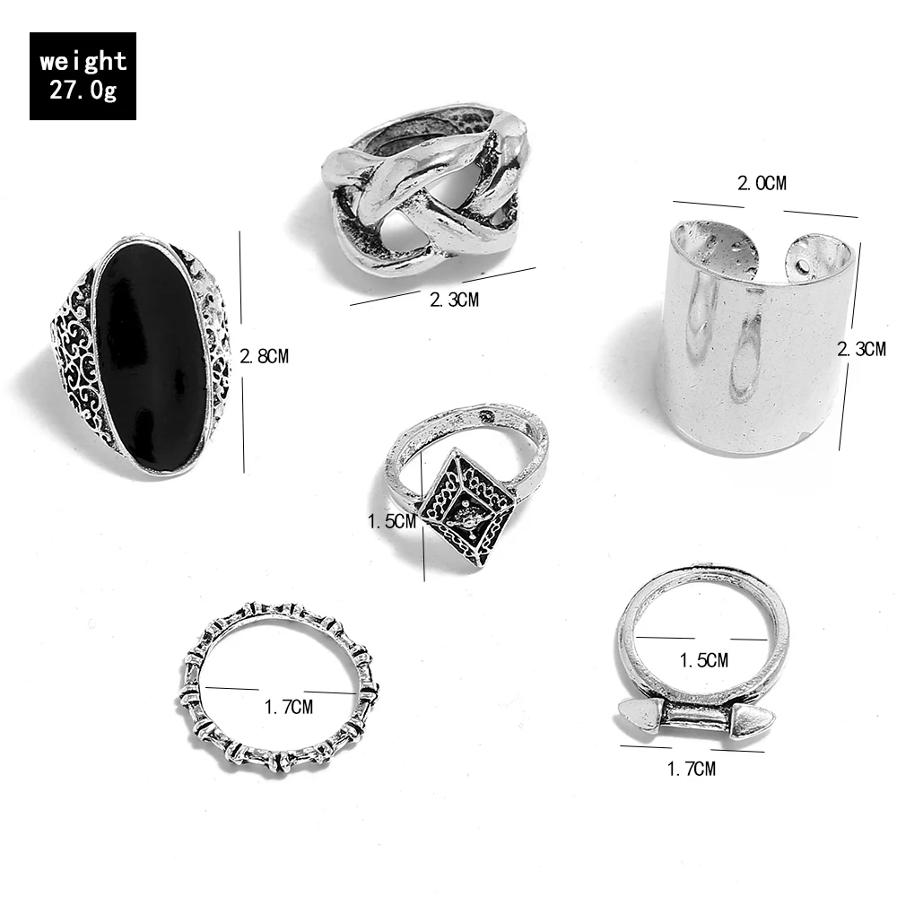 Кольцо женское серебристого цвета с вырезами на костяшки черного | Украшения и