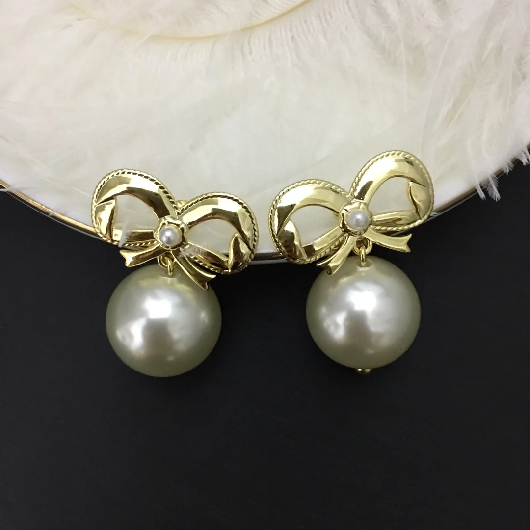 

Fashion new pearl diamond bow earrings earrings net red temperament design earrings
