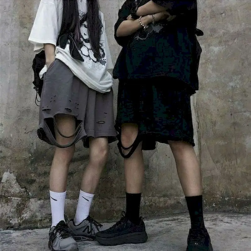 

Shorts female Korean ins Harajuku street trend hole shorts irregular color matching casual five-point pants men and women tide