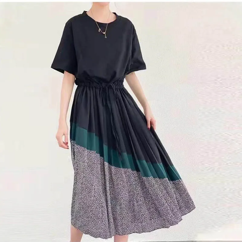 

Loose sexy irregular black and white contrast rivet dress for women in spring and summer of 2021