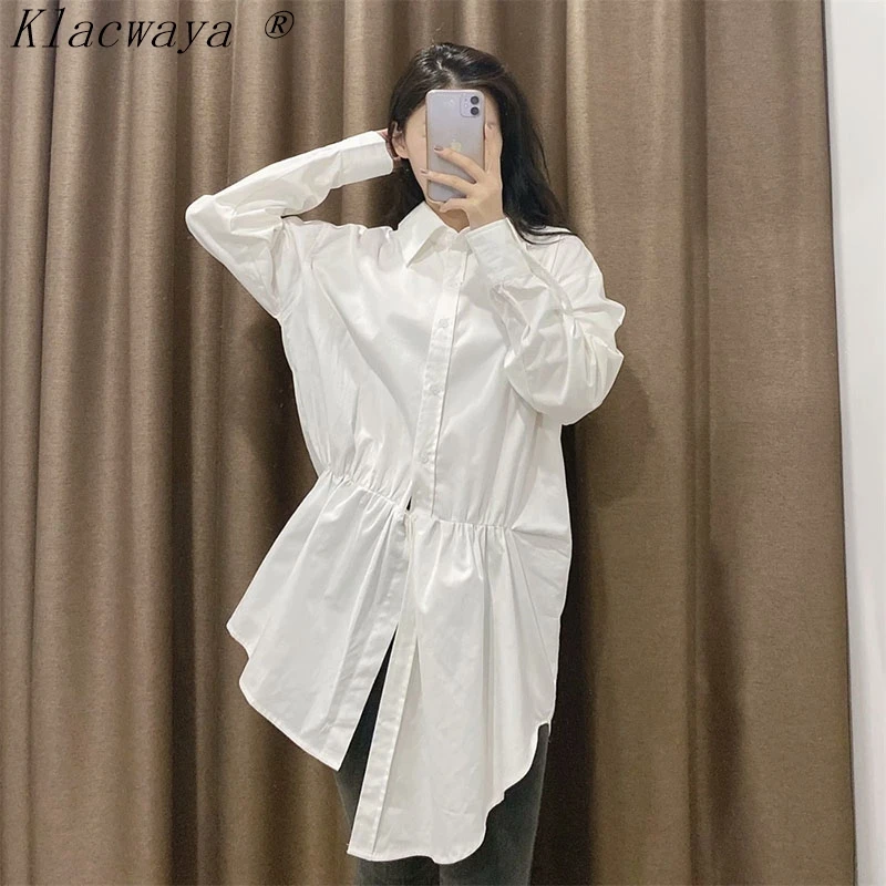 

XEASY Women's Chic Irregular Hem Blouse Plain Color Lapel Long Sleeve Single-Breasted Medium Length Blouse New For Spring