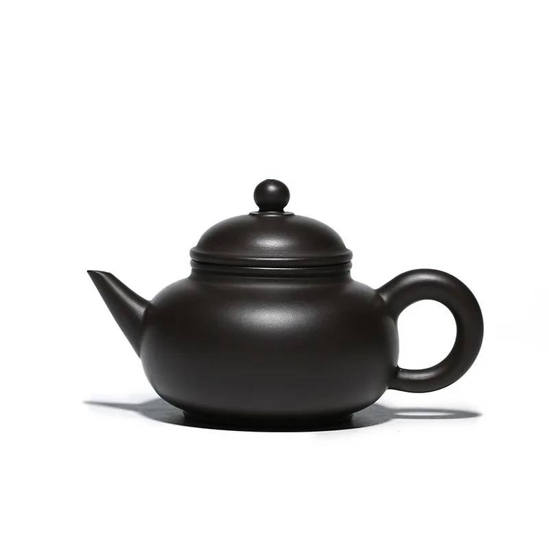 

Small horizontal purple clay teapot