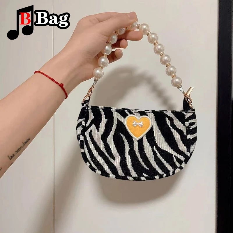 Женская мини-сумка через плечо с принтом зебры и бантом жемчужной цепочкой |