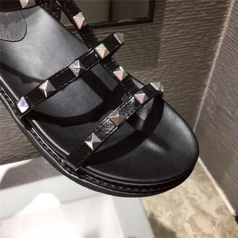 

YMECHIC Black Color T-strap Gladiator Rivet Decor Sandals Women 2020 Summer Sexy Open Toe Flat Heel Beach Shoes Ladies Vintage