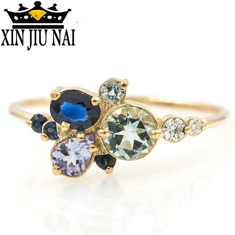 Женское кольцо с голубым пузырьком золотого цвета разноцветным кубическим