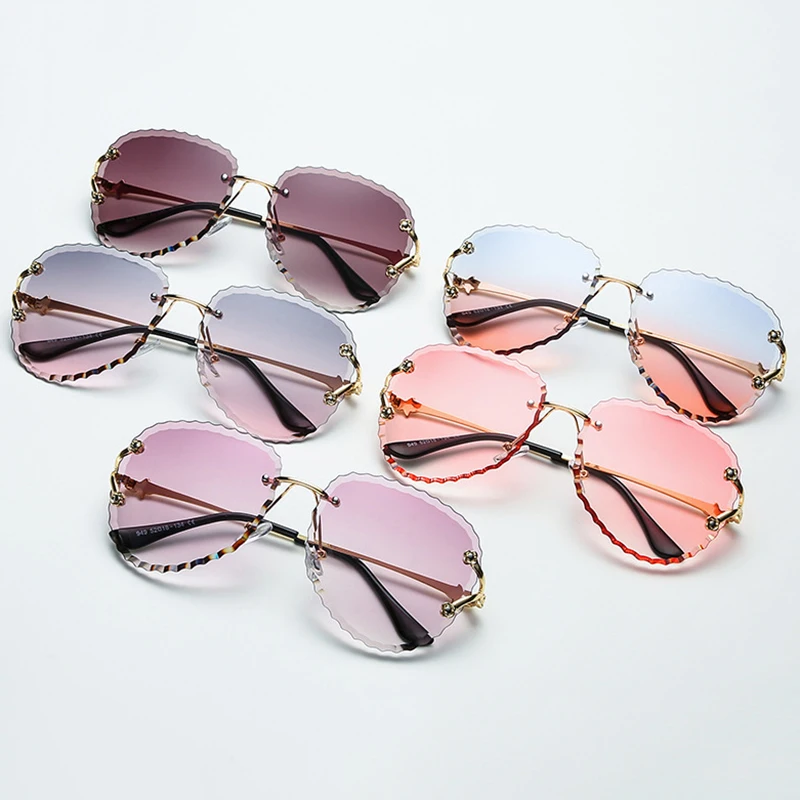 

2020 New Fashion Brand Design Rimless Sunglasses Women Vintage Sexy Lady Cutting Lens Wave Frame Sun Glasses For Female UV400
