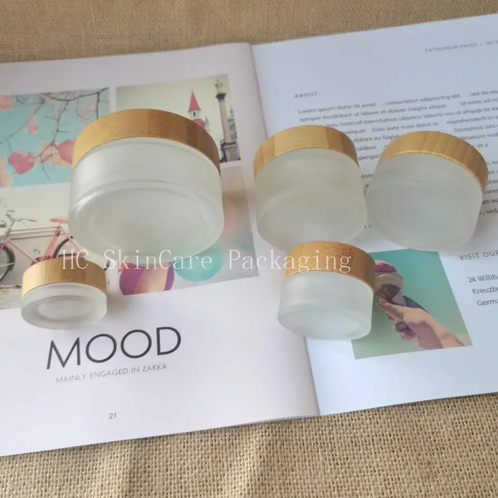 

Изготовленным на заказ логосом Красота матовое прозрачное стекло макияж крем банку с бамбуковой крышкой для ухода за областью вокруг глаз ...