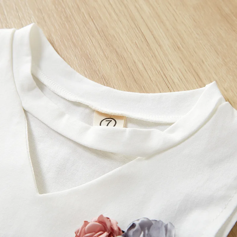 

Girls Outfits 2021 Summer New Children Korean Girl Sleeveless Solid Color Flower Top + Leaf Printed Skirt Two-piece Set