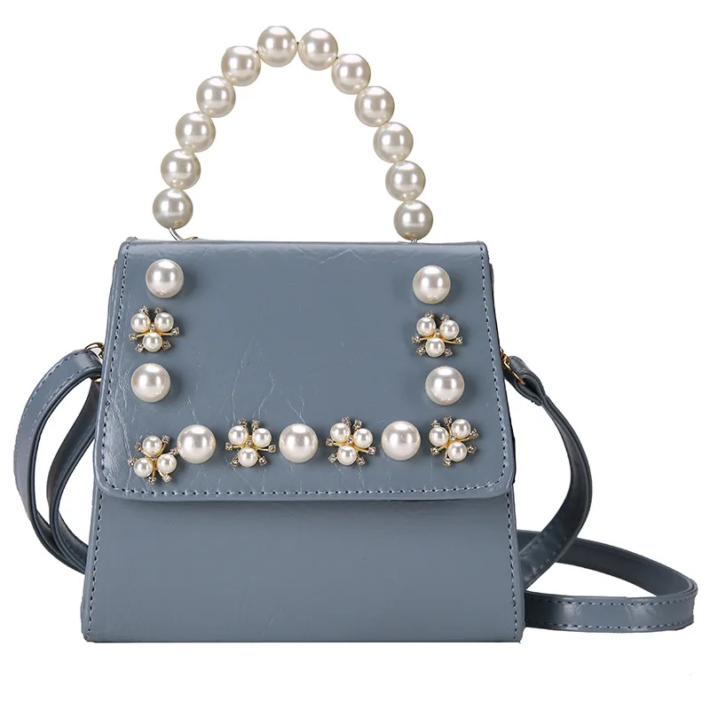 

Small bag female 2020 new Korean version of the western style fashion pearl portable wild shoulder messenger saddle bag