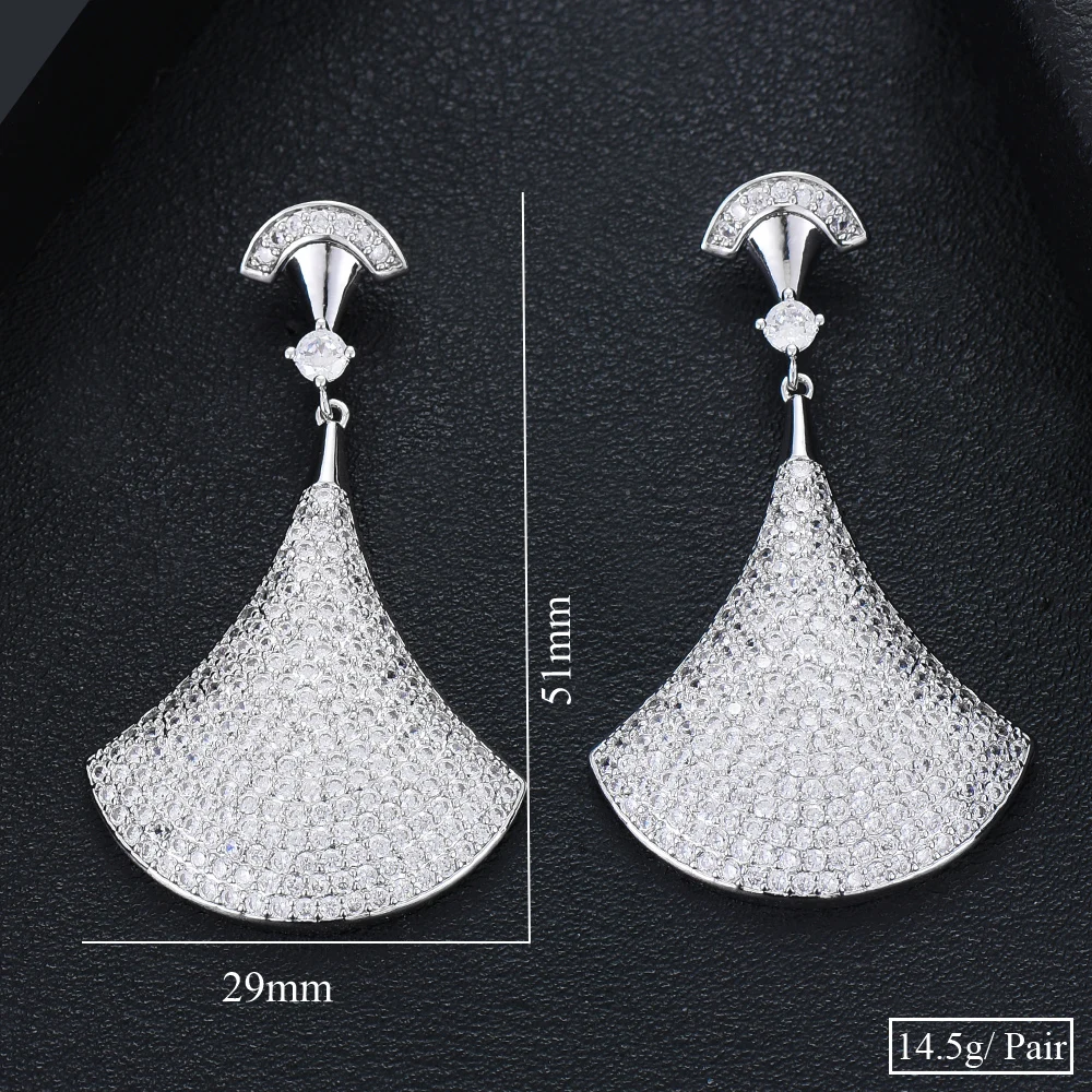 

KellyBola Jewelry's luxurious and shiny fan-shaped pendant earrings. Unique and elegant earrings designed for women.