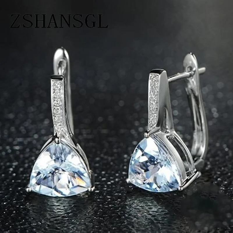 Женские серьги гвоздики серебристого цвета с светильник