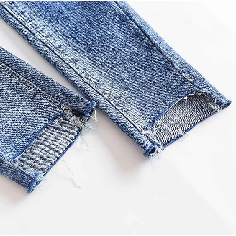 Размера плюс удлиненные дизайн отверстия зауженные джинсы Высокая талия