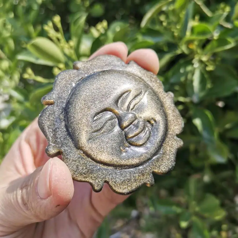 

Natural gold obsidian carved sun face