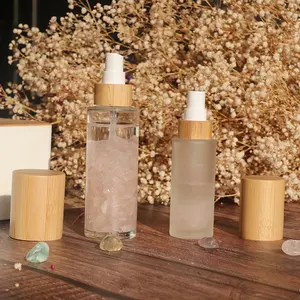 Customized logo bamboo pump cap frosted glass lotion bottles 100ml 120ml 150ml skin care glass toner for vitamin c oil cleanser